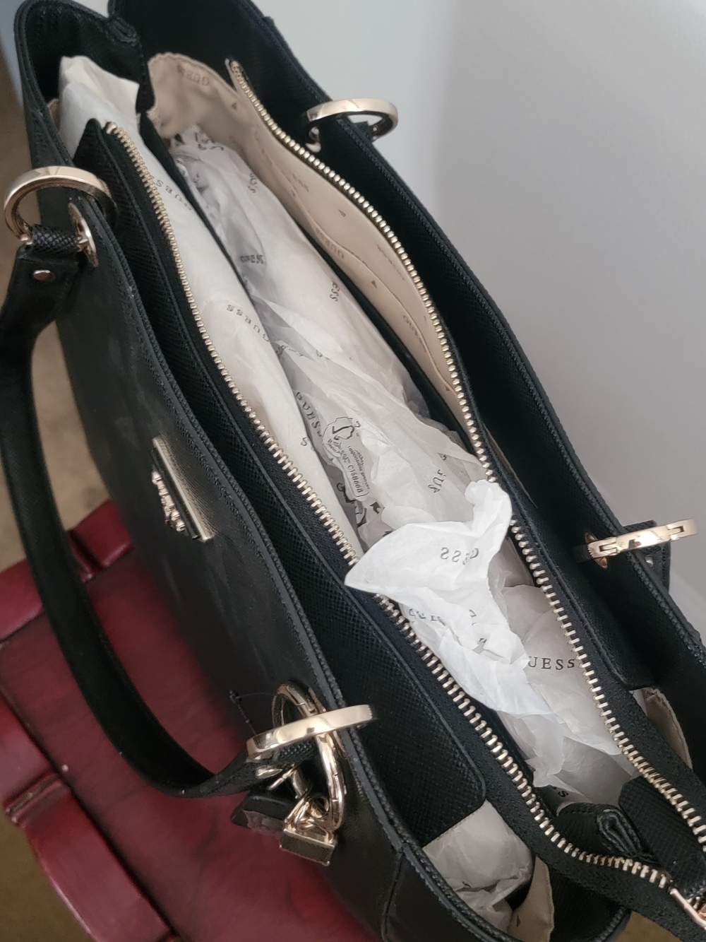 GUESS Black Tote with Gold Hardware and Charm - Picture 3 of 4